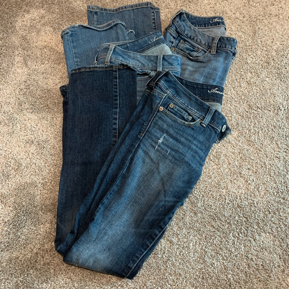 Three pairs of American Eagle jeans